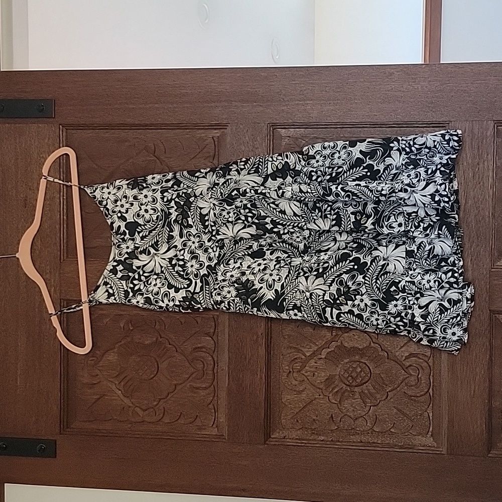 Short sun dress by Paani. Size med.  New condition, never worn. Black/white/gold